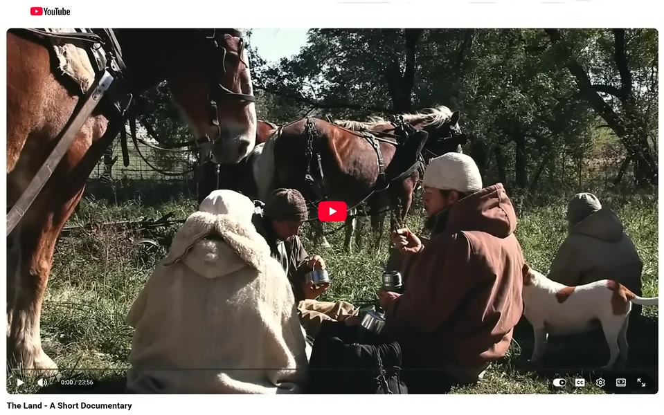 Still from "The Land — A Short Documentary," showing community members and horses at work outdoors